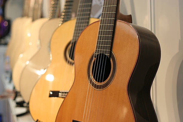 istock Acoustic guitars in a row 90392884