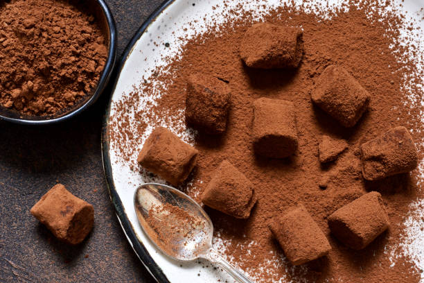 istock Chocolate truffle with avocado and cocoa powder on a brown background. 903932266