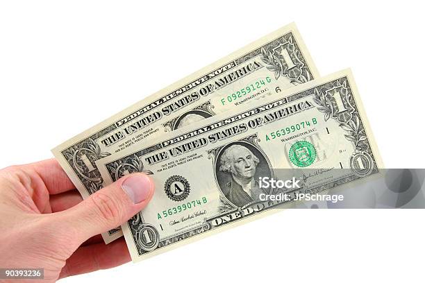 Foto de Dois Dólares Na Mão e mais fotos de stock de Nota de dólar americano - Nota de dólar americano, Dois Objetos, Símbolo do Dólar