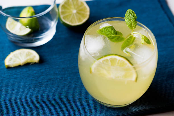 istock Yellow Lemonade Cocktail with Lime and ice. 903932420
