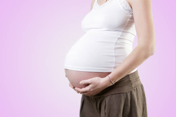 istock Pregnant woman belly - studio shot 903932438