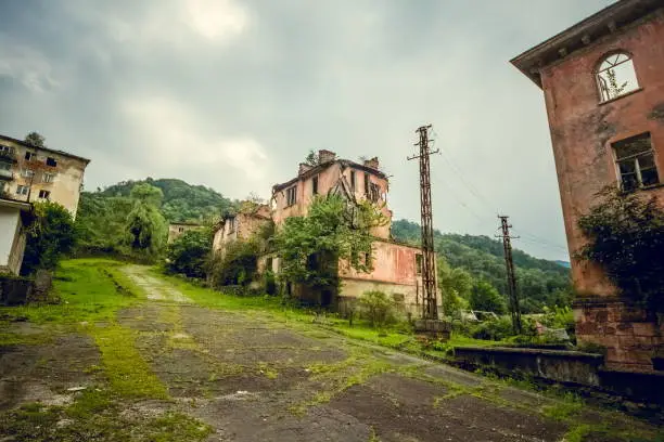 Abandoned mining ghost-town Jantuha, Abkhazia. Destroyed empty houses, the remains of the cars, remnant of The Georgian-Abkhazian war