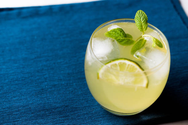 istock Yellow Lemonade Cocktail with Lime and ice. 903938364