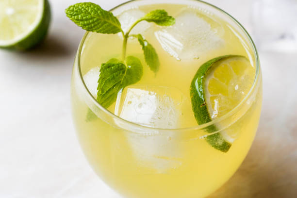 istock Yellow Lemonade Cocktail with Lime and ice. 903938974