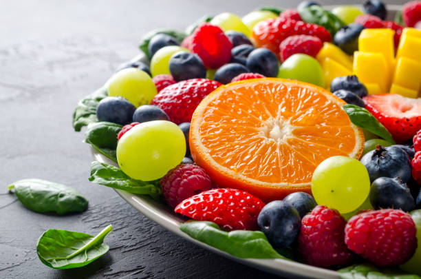 istock Fruit platter with various fresh fruits and berries 903942272