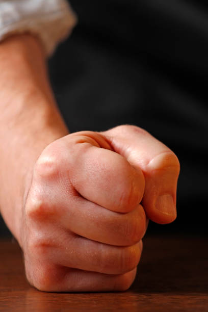 istock Man hitting the desk his with clenched fist. 903960014
