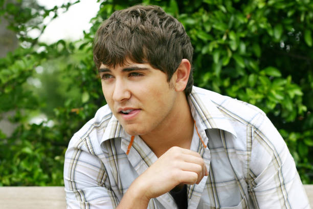 istock Young male model sitting in a park. 90396022