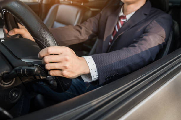 istock Midsection Of Business Man Driving Car 903960506