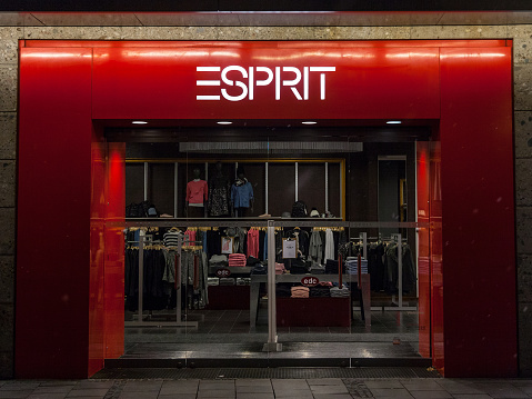 Picture of the Munich Esprit shop at night. Esprit is a publicly owned manufacturer and seller of clothing, footwear, accessories, jewellery and housewares
