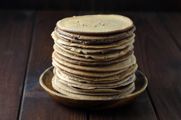 istock Chocolate pancakes on wooden table. 903968322