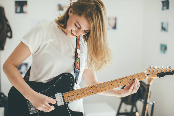 istock Blond woman guitarist 903968338