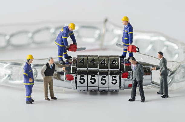 istock Close-Up Of Human Figurines With Lock On Table 903968608