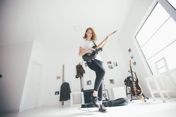 istock Beautiful woman guitarist 903968650