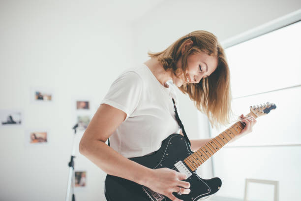 istock Beautiful girl guitarist 903968694