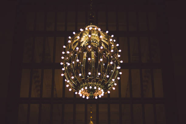 istock Low Angle View Of Illuminated Chandelier On Ceiling 903969054
