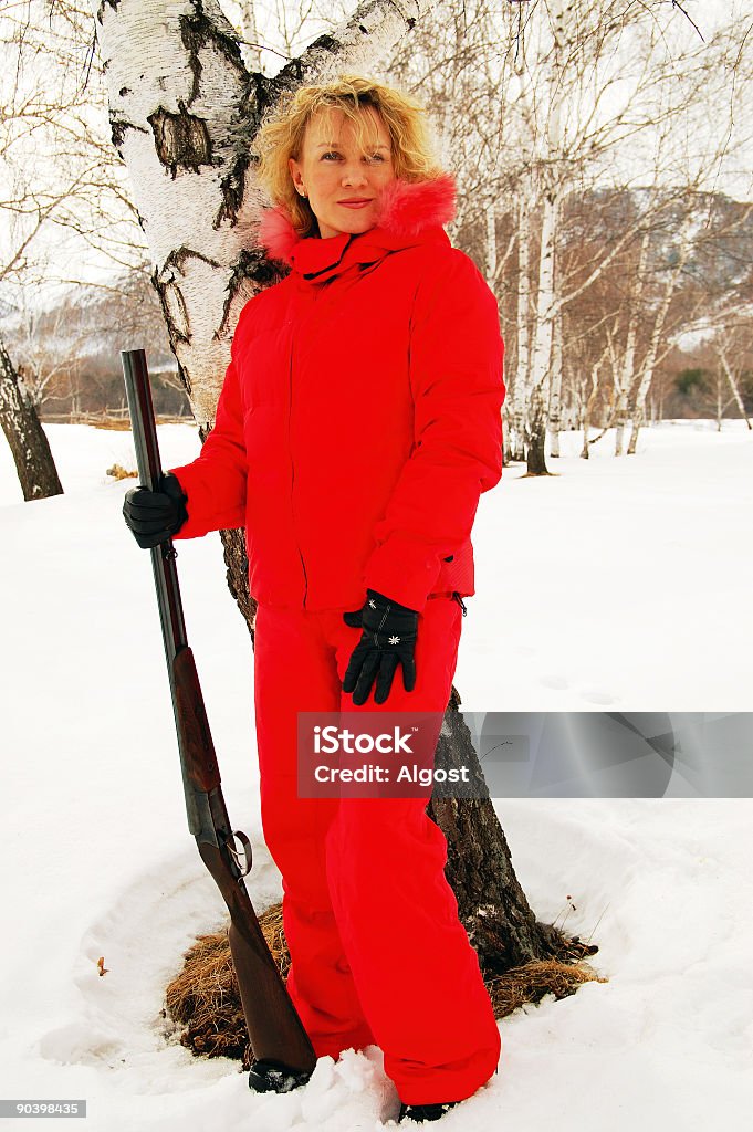 Giovane donna con la pistola - 14 - Foto stock royalty-free di Acchiappino