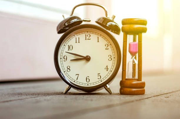 istock Close-Up Of Clock On Floor At Home 903989418