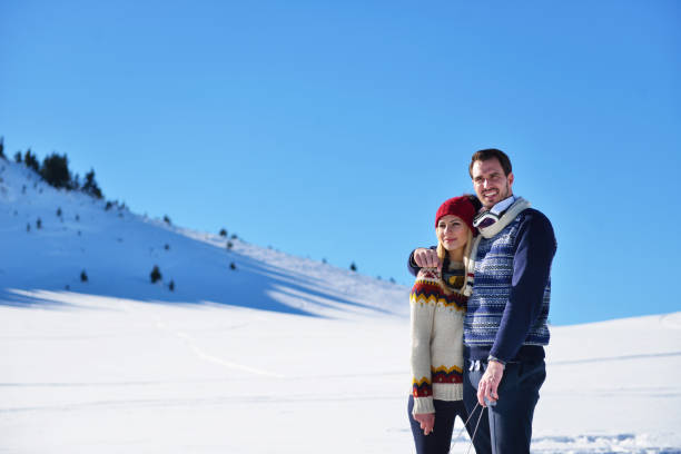 istock Young Couple Sledding And Enjoying On Sunny Winter Day 903989438