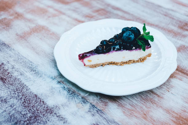 istock A piece of blueberry cheesecake on wooden table. 903997366