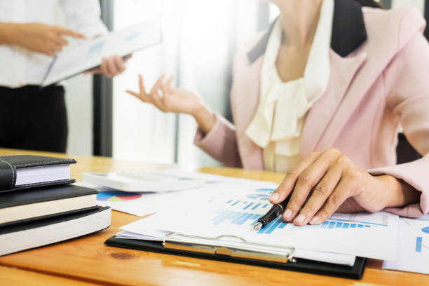 istock Midsection Of Business People Discussing At Table In Office 903997406