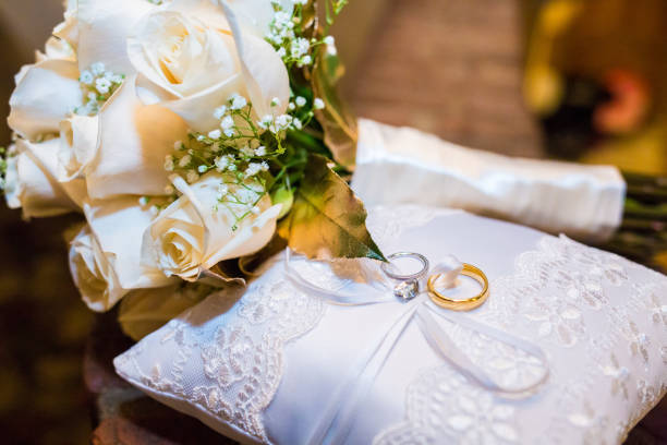 istock Wedding bouquet of roses with two rings 904004044