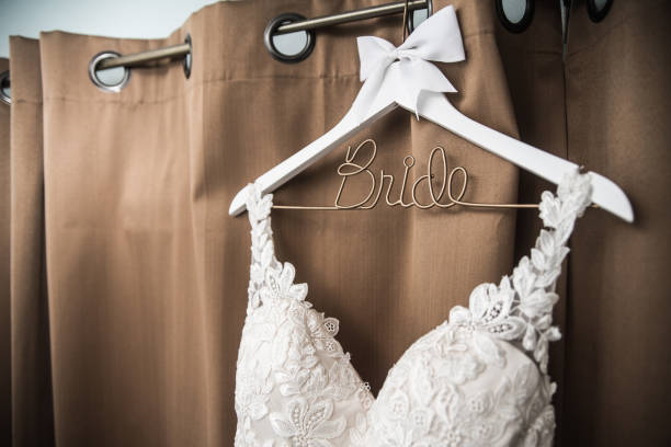 istock Hanging Wedding Dress 904008804