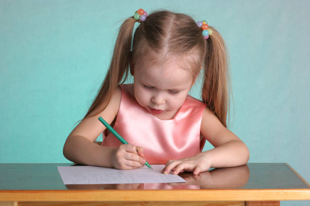 istock Little girl write letters of alphabet 90401081