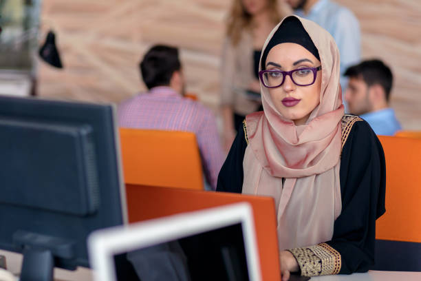 istock Attractive Muslim young woman working in office on computer 904018260
