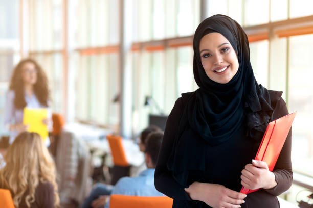 beautiful modern Muslim businesswoman portrait in office beautiful modern Muslim businesswoman portrait in office. pics of a cute muslim outfits stock pictures, royalty-free photos & images