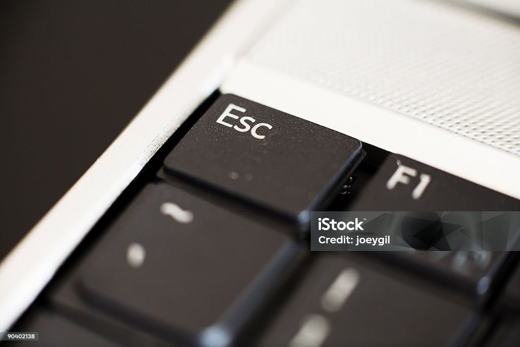 Keyboard ESC Key Detail Close up of a laptop detail on Esc key CPU Stock Photo