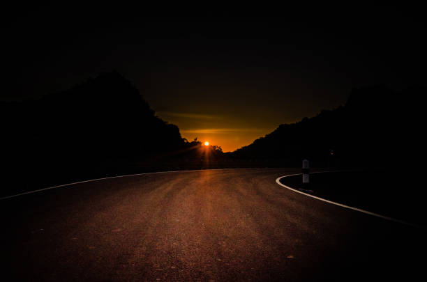 istock Dark Curve Road at Evening Sun Down  Less light 904021678