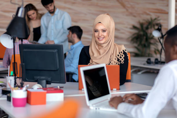 istock Attractive Muslim young woman working in office on computer 904021902