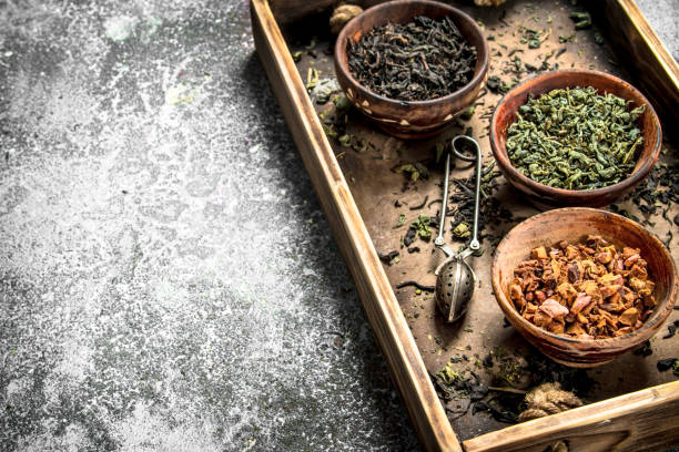 istock Different kinds of fragrant tea in bowls. 904025980