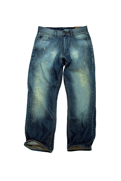 istock Destructed Denim: Faded and Frayed Jeans on White Background 90402748