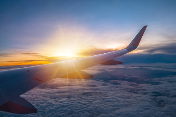 istock Amazing sunrise view from the window seat on airplane. 904028452