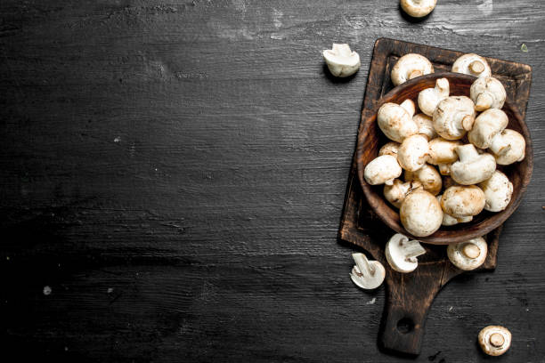 istock Fresh mushrooms on the board. 904028752