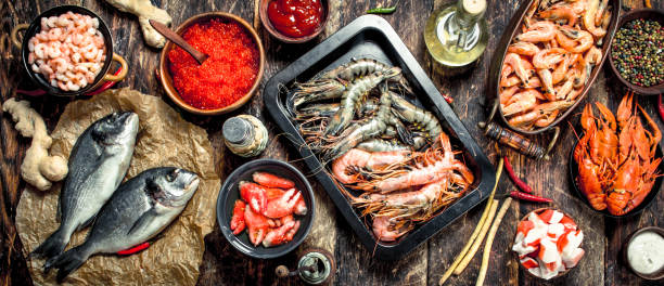 istock Different seafood with shrimps and red caviar. 904029996