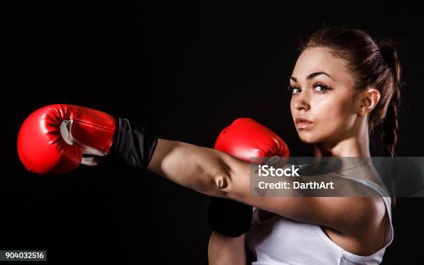 Beautiful Young Woman In A Red Boxing Gloves Stock Photo - Download Image Now - Boxing Glove, Stretching, Active Lifestyle
