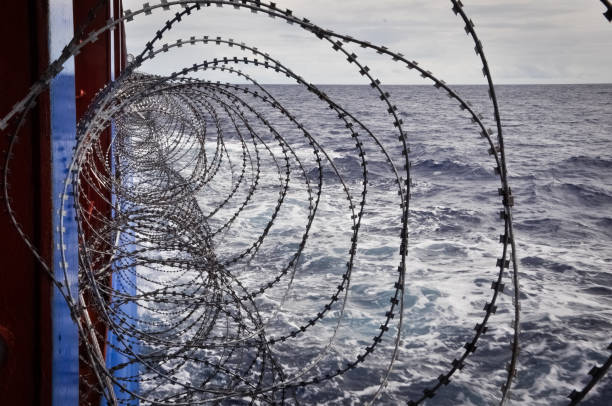 istock Barbed wire onboard of a shp passing pirats area 904032636