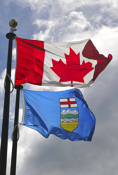 Flags of Canada and Alberta  canada flag blue sky clouds stock pictures, royalty-free photos & images