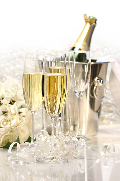 Champagne and a bouquet of roses stock photo