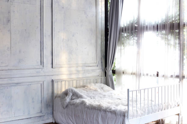 istock white bedroom with window and curtain 904044060