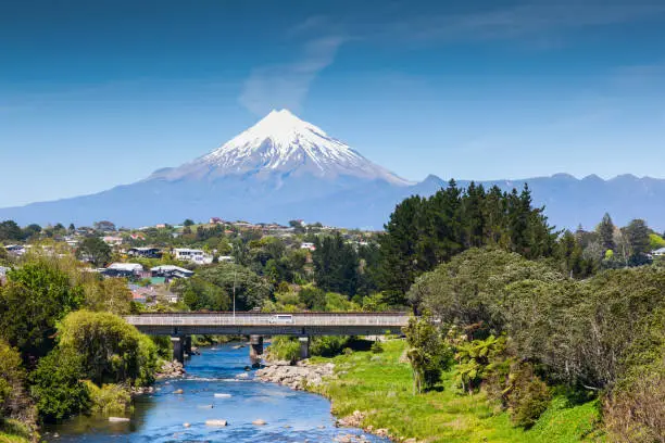 The Waiwhakaiho River, the city of New Plymouth, and Mount Taranki, New Zealand.
