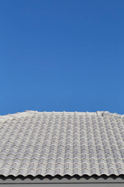 istock Gray tile roof against the blue sky. Construction 904044290