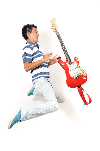 istock Teen jumping with guitar 90404561