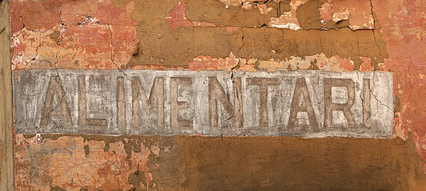 istock ALIMENTARI sign painted on the wall 90405173