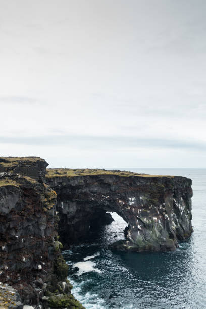 istock Natural Arch On Icelandic Coast 904051824