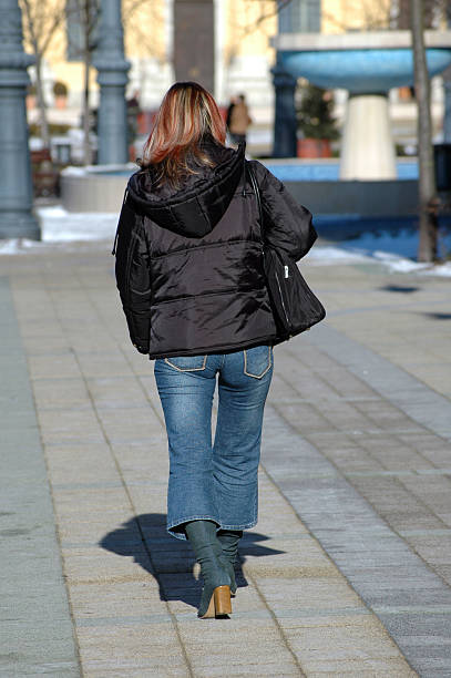 istock woman walking on the street 90405212