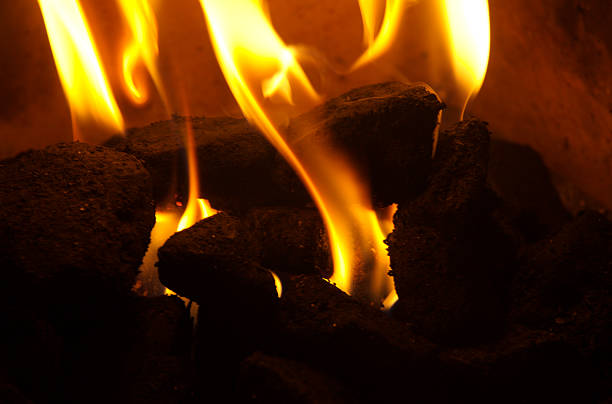 Flaming coal stock photo