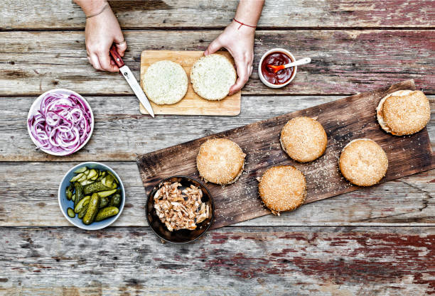 istock Burger burgers and burger ingredients on a wooden kitchen table 904056626